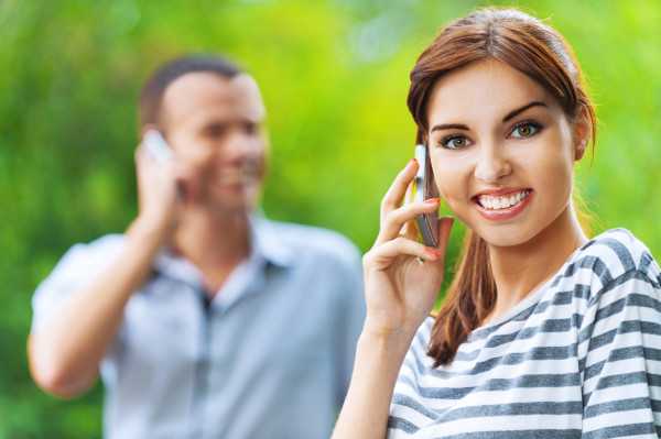 portrait young beautiful happy couple talking phone